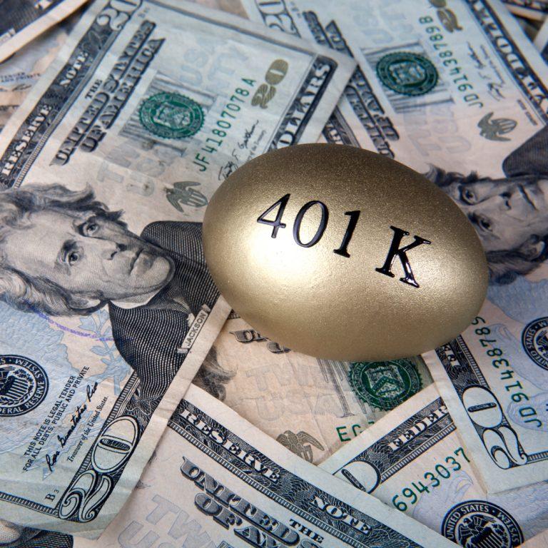 401k golden nest egg on top of $20 bills.