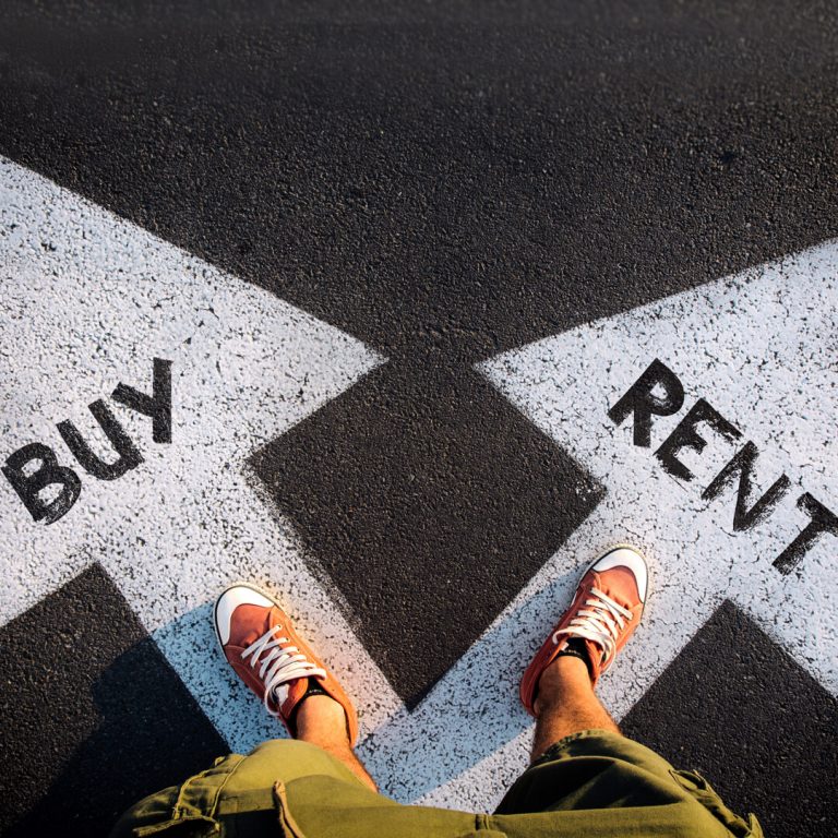 Feet standing at fork in road: an arrow to "buy" and an arrow to "rent."