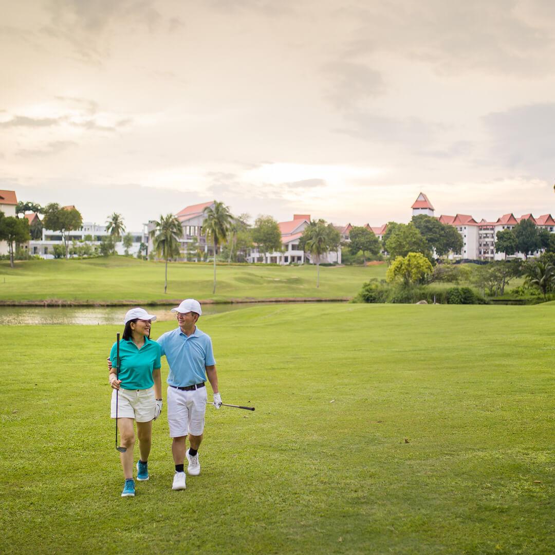 Country Club Grounds and couple playing golf
