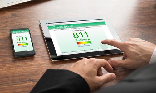 Man checking credit score - screen shows an excellent credit score of 811.
