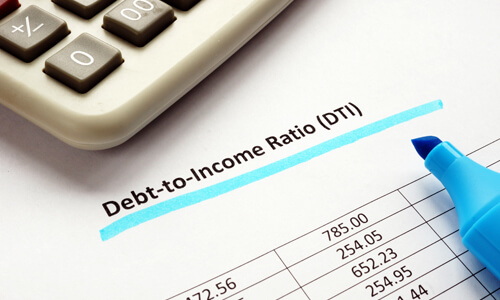 Close-up paperwork of debt to income ratio statement and calculator