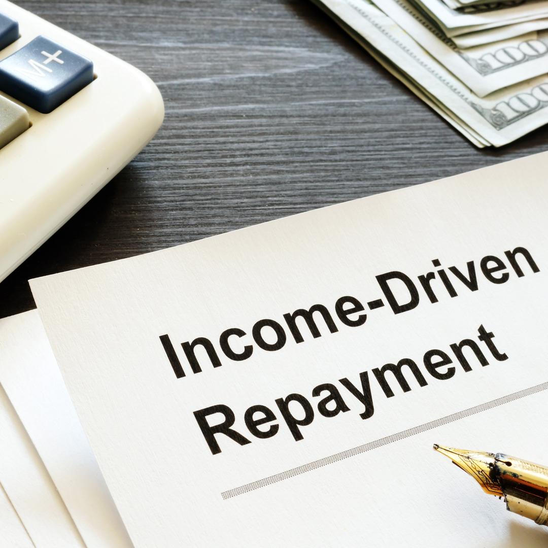 Income Driven Repayment Form on table next to a calculator