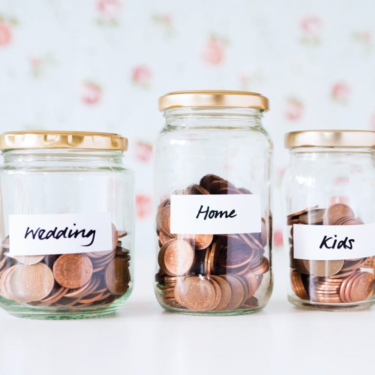 Four different budget jars: Wedding, Home, Kids and Retirement.