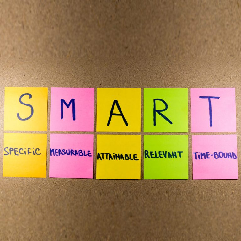 The letters "SMART" posted to a bulletin board.