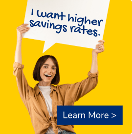Woman holding a sign that says I want higher savings rates.