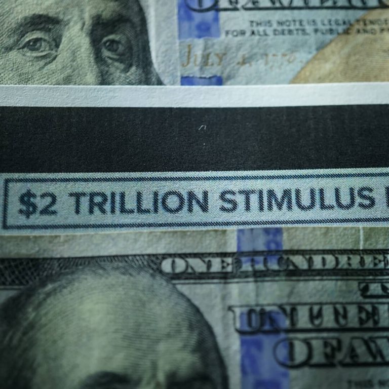 Closeup of dollar bill that says $2 Trillion Stimulus Package