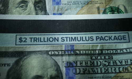 Closeup of dollar bill that says $2 Trillion Stimulus Package