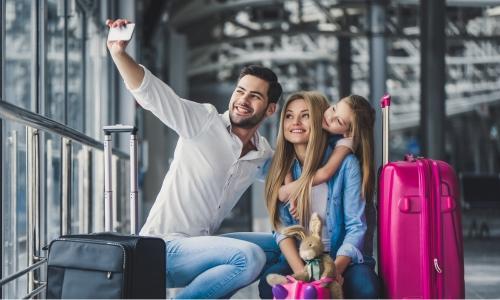 A family excitedly begins their holiday travels secure with their travel insurance through Quorum.