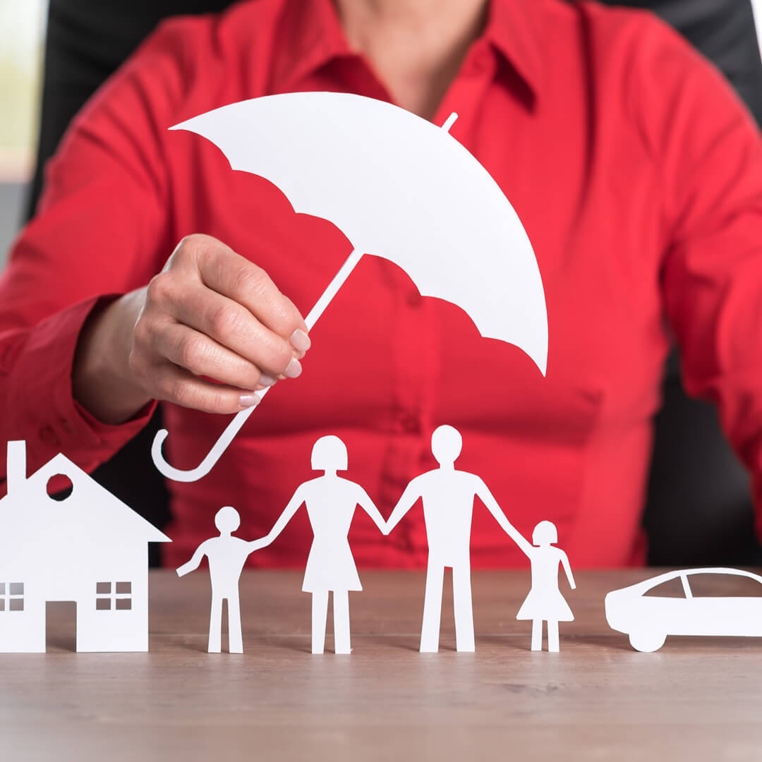 Cut out of home, family, and automobile with an umbrella over, representing umbrella insurance