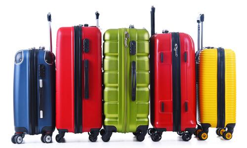Bright luggage on a white background: a shopping deal to score in March.