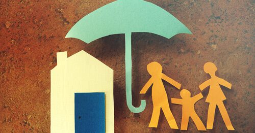 Paper cutouts of home, family and umbrella, illustrating homeowners insurance.
