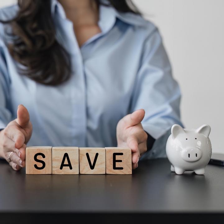 A woman spells out "save" as she considers a Quorum Term Savings account.