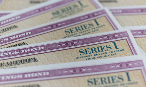 Stack of Series I US Savings Bonds. Savings bonds are debt securities issued by the U.S. Department of the Treasury.