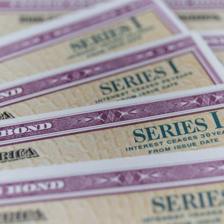 Stack of Series I US Savings Bonds. Savings bonds are debt securities issued by the U.S. Department of the Treasury.
