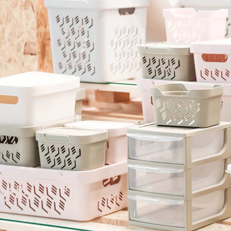 Storage bins (a great deal in August) stacked up in a department store.